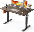 FEZIBO Standing Desk, 63×28 Inches Electric Height Adjustable, Sit Stand Up, Computer Office Desk with Splice Board, Black Frame/Black Walnut TOP