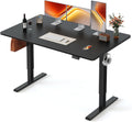 FEZIBO Standing Desk, 55×28 Inches Electric Height Adjustable, Sit Stand Up, Computer Office Desk with Splice Board, Black Frame/Black TOP