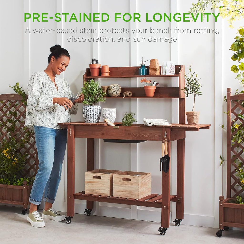 Best Choice Products Mobile Garden Potting Bench, Outdoor Wood Workstation Table w/Sliding Tabletop, 4 Locking Wheels, Food Grade Dry Sink, Storage Shelves - Brown